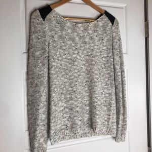 White, black, and silver thread sweater